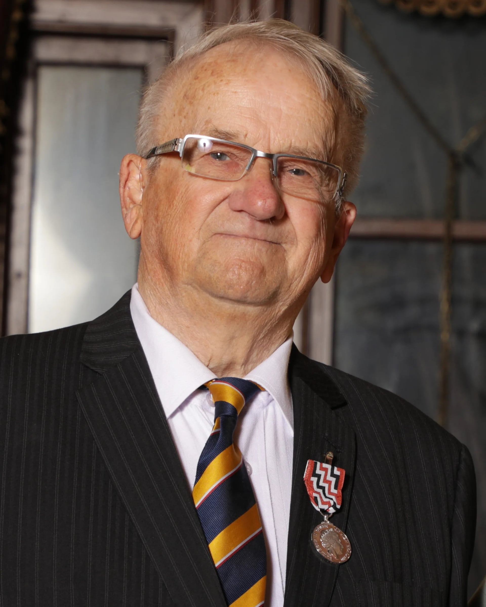 Portrait of Neill Price (1936–2025) – memorial page