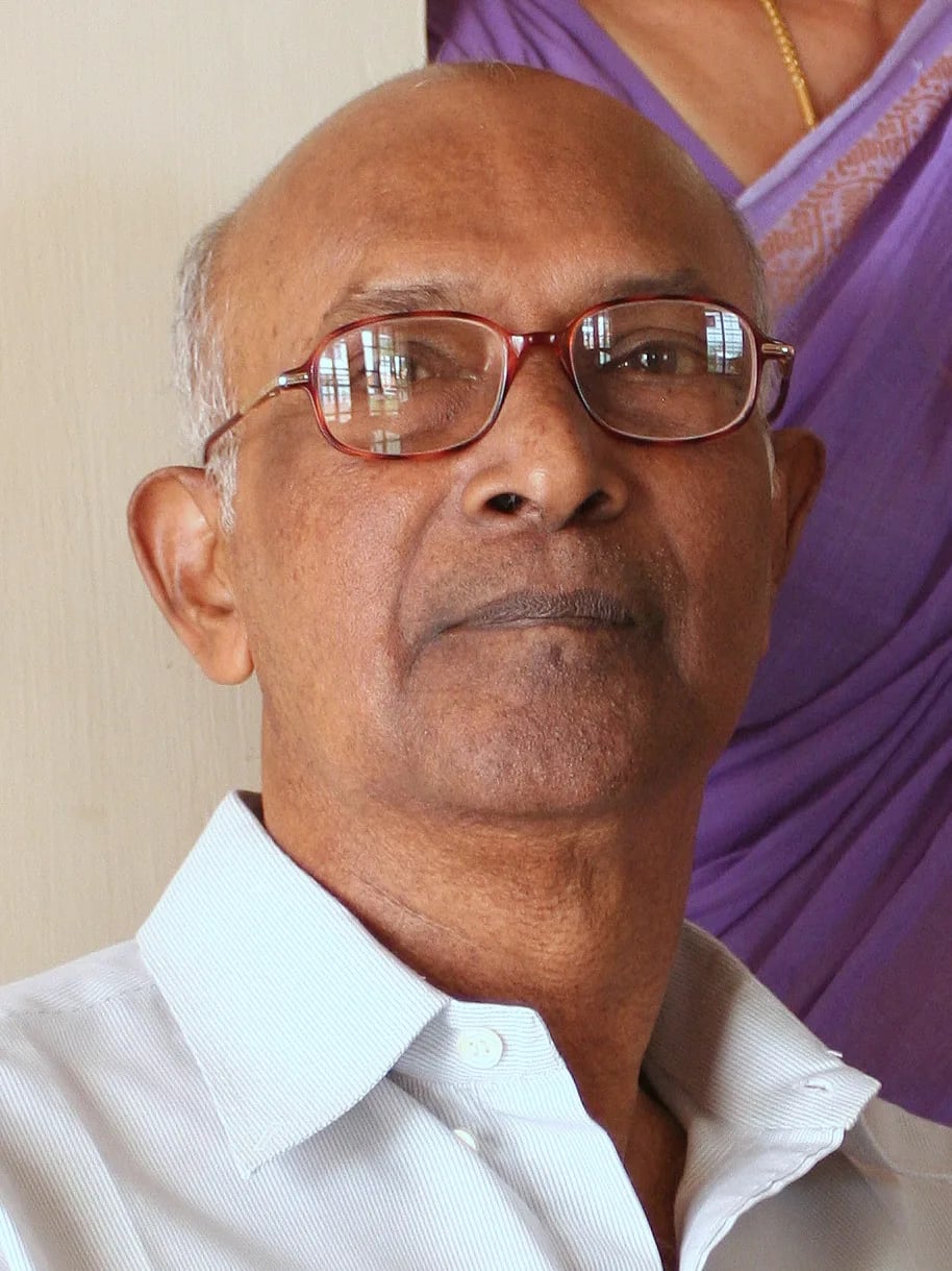 Porträt von Kattungal Subramaniam Manilal (1938–2025) – Gedenkseite