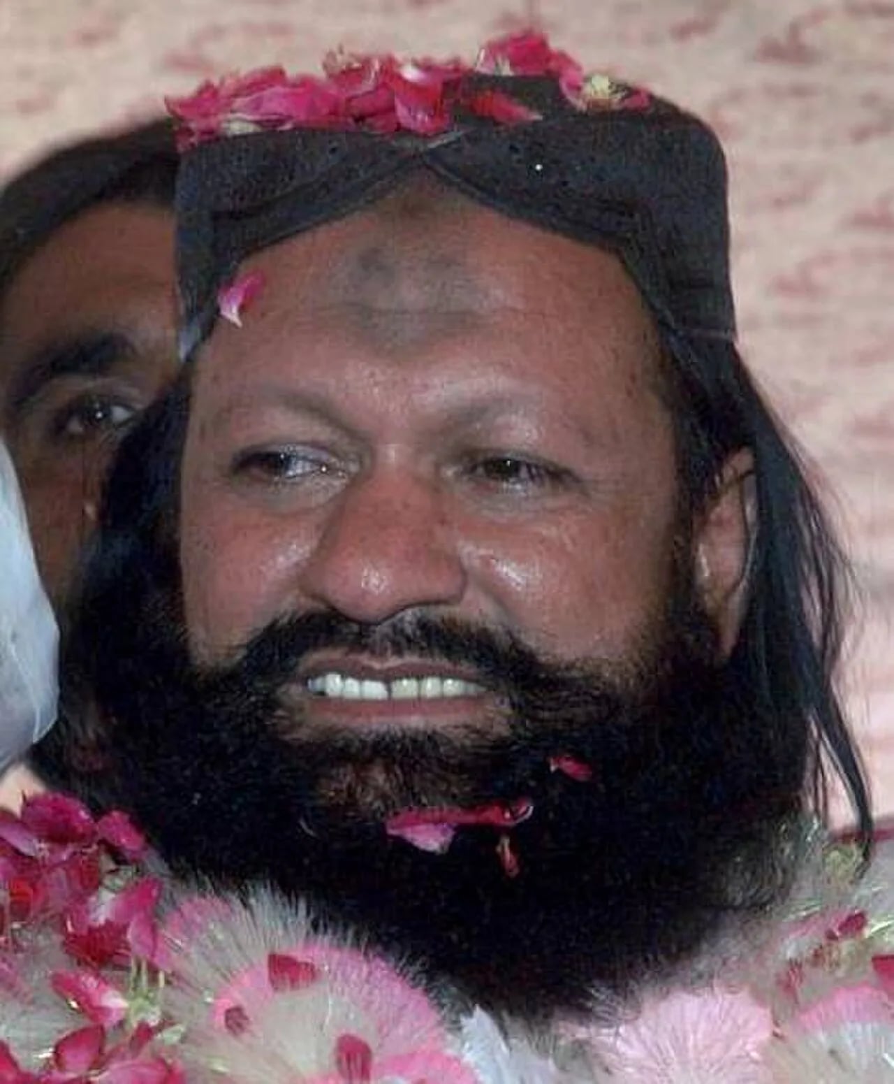 Portrait of Malik Ishaq (1959–2015) – memorial page