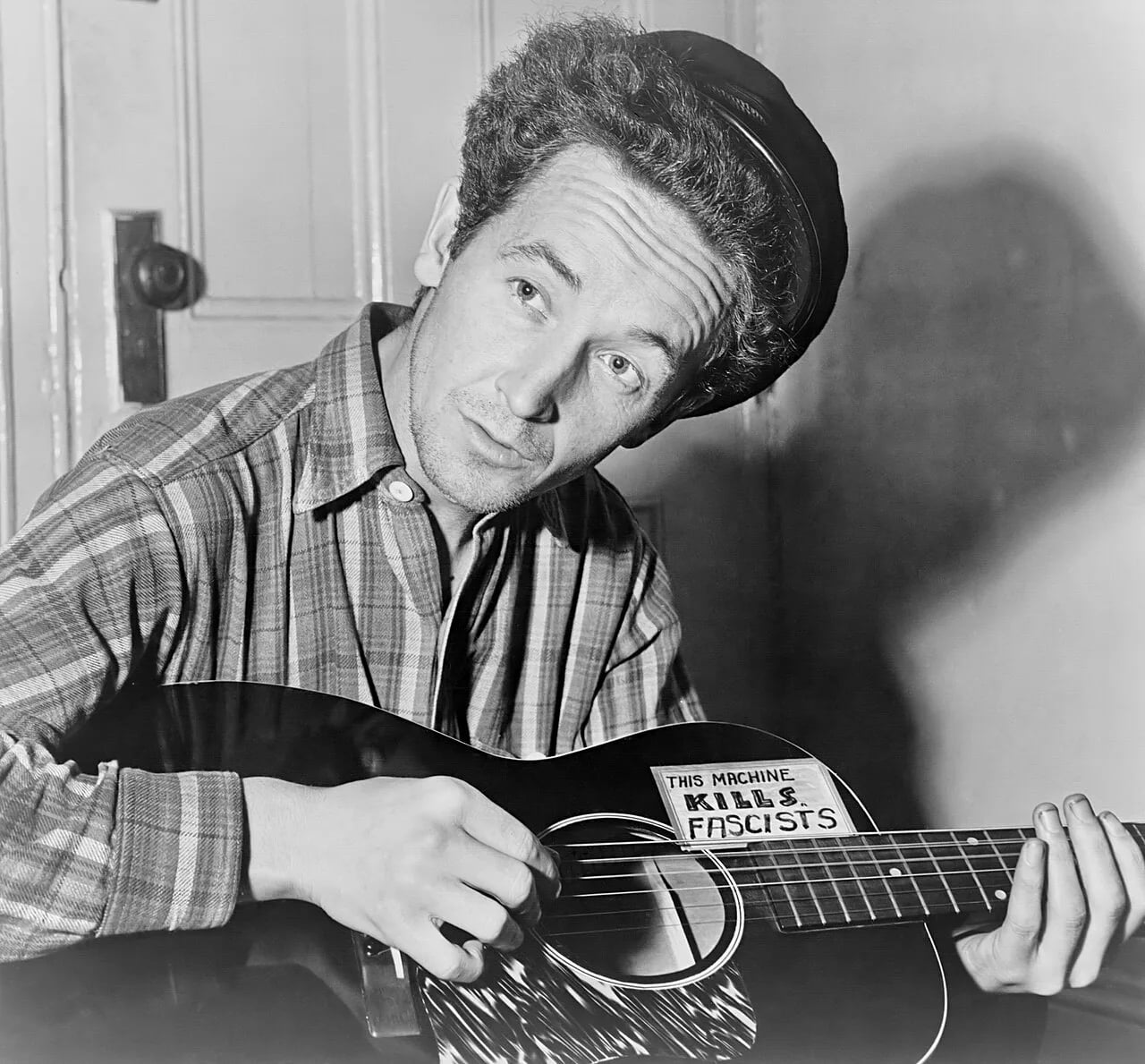 Porträt von Woody Guthrie (1912–1967) – Gedenkseite