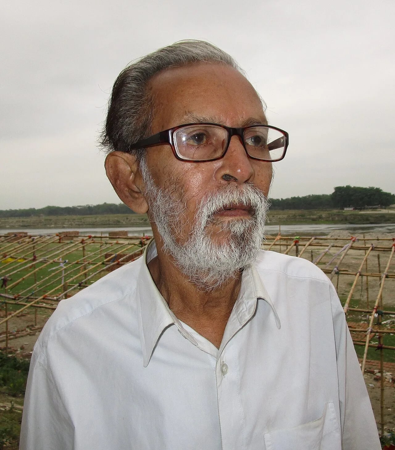 Porträt von Musharraf Karim (1946–2020) – Gedenkseite