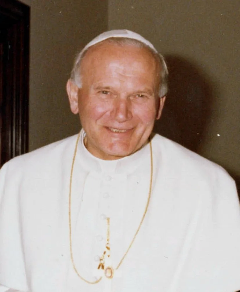 Pope John Paul II smiling in a white cassock