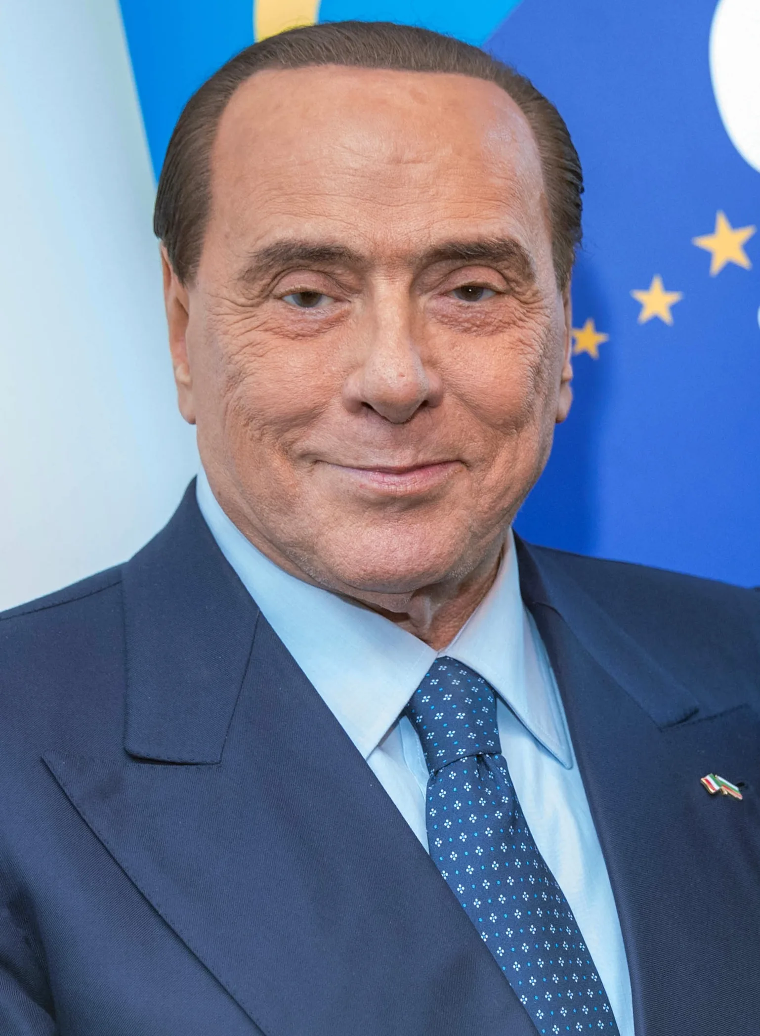 Silvio Berlusconi in 2018 in front of European flags