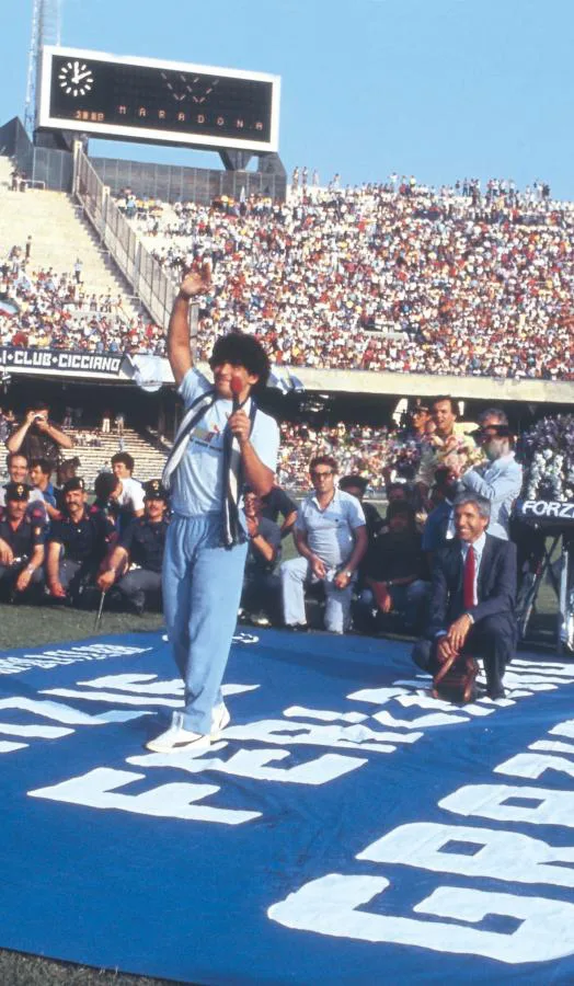 Diego Maradona waving during his presentation at the Stadio San Paolo in Naples