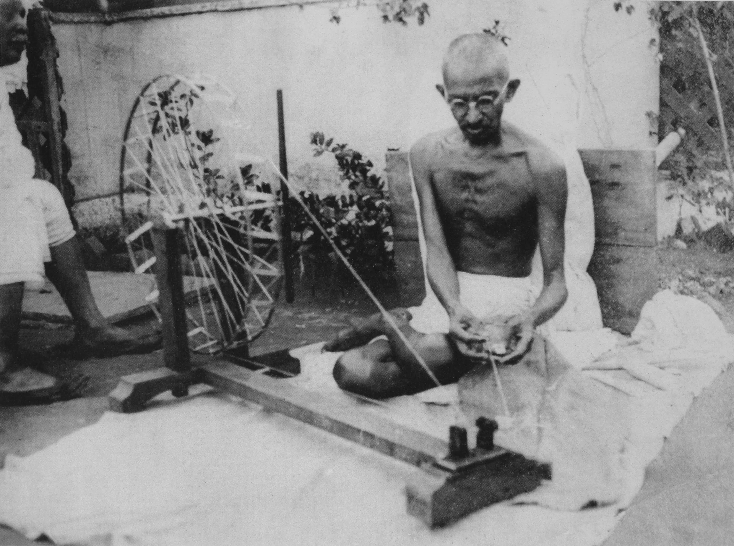 Gandhi spinning yarn as a symbol of khadi and self-reliance